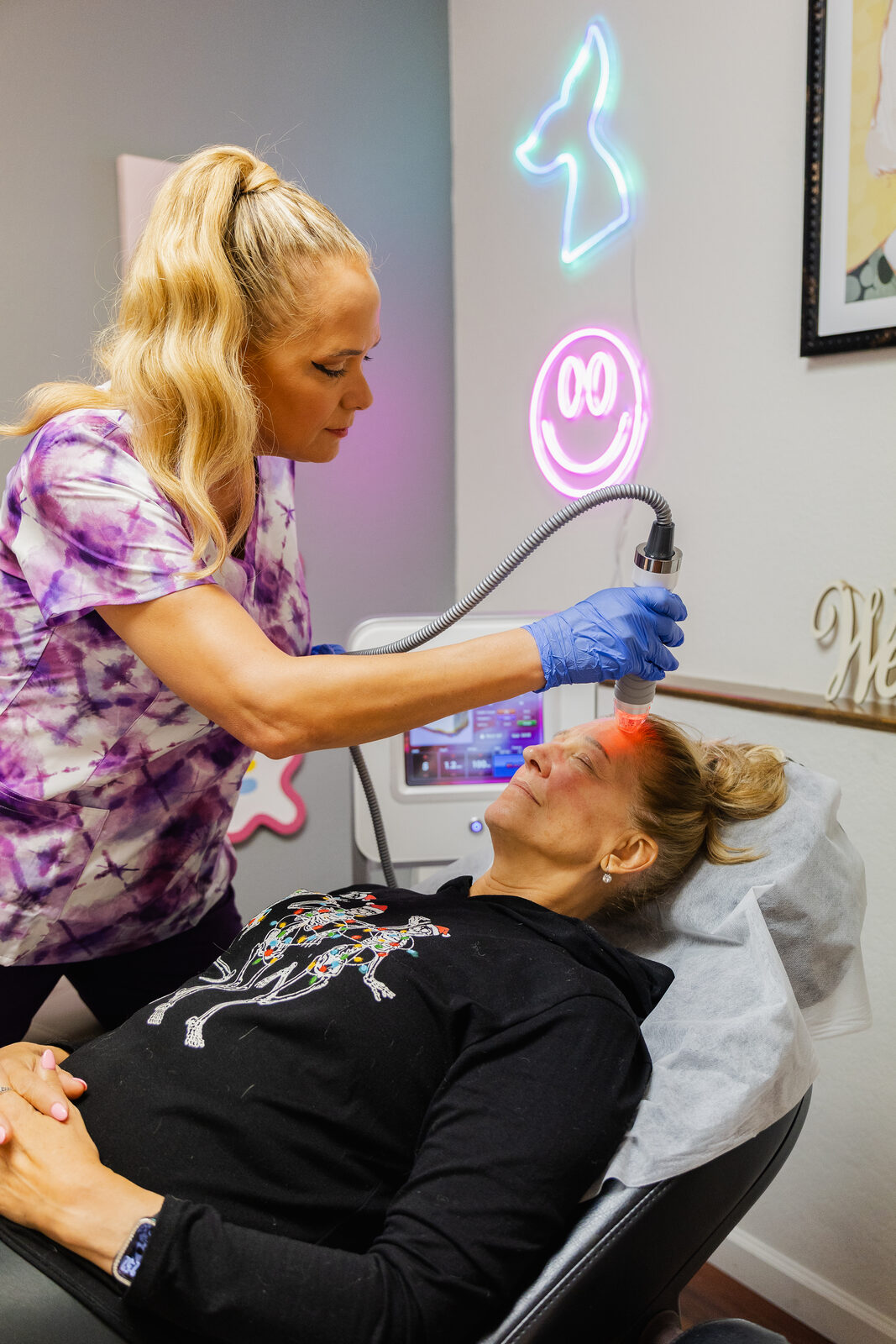 A woman receiving a treatment at Skinpoint Rejuvenation